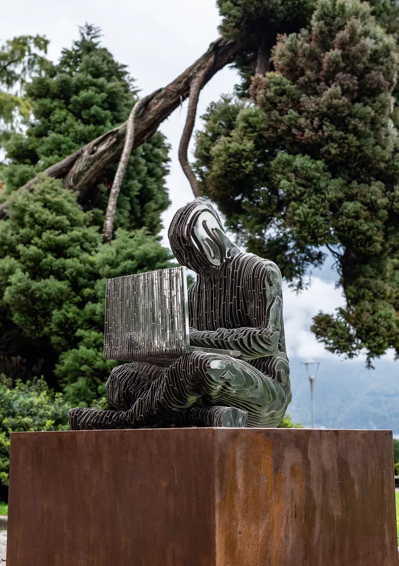 Satoshi sculpture in the park in Lugano.